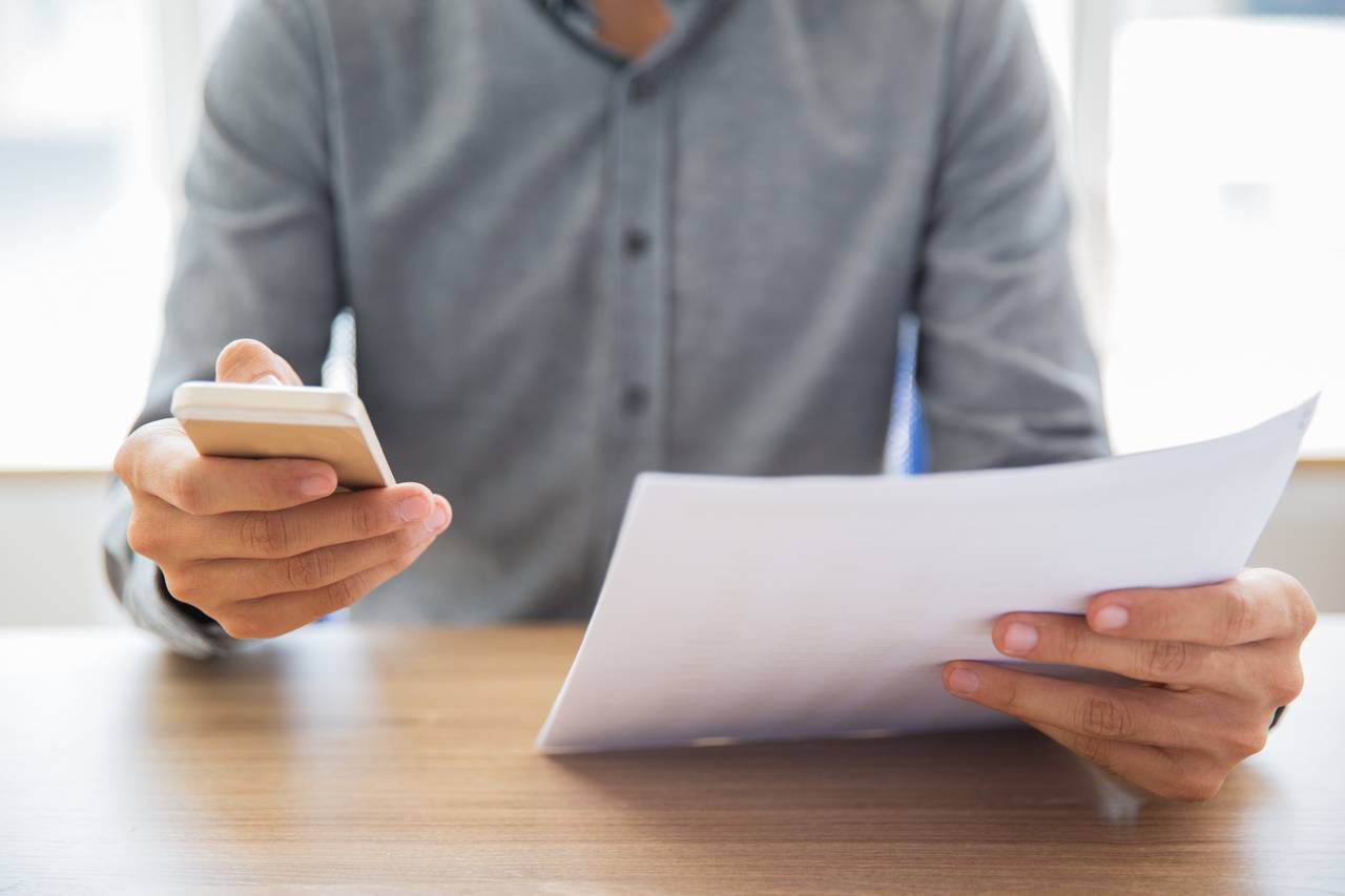 Businessman Reading Document Texting Message