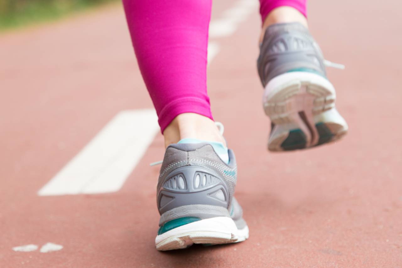 Close Up Female Feet Sport Shoes Stadium